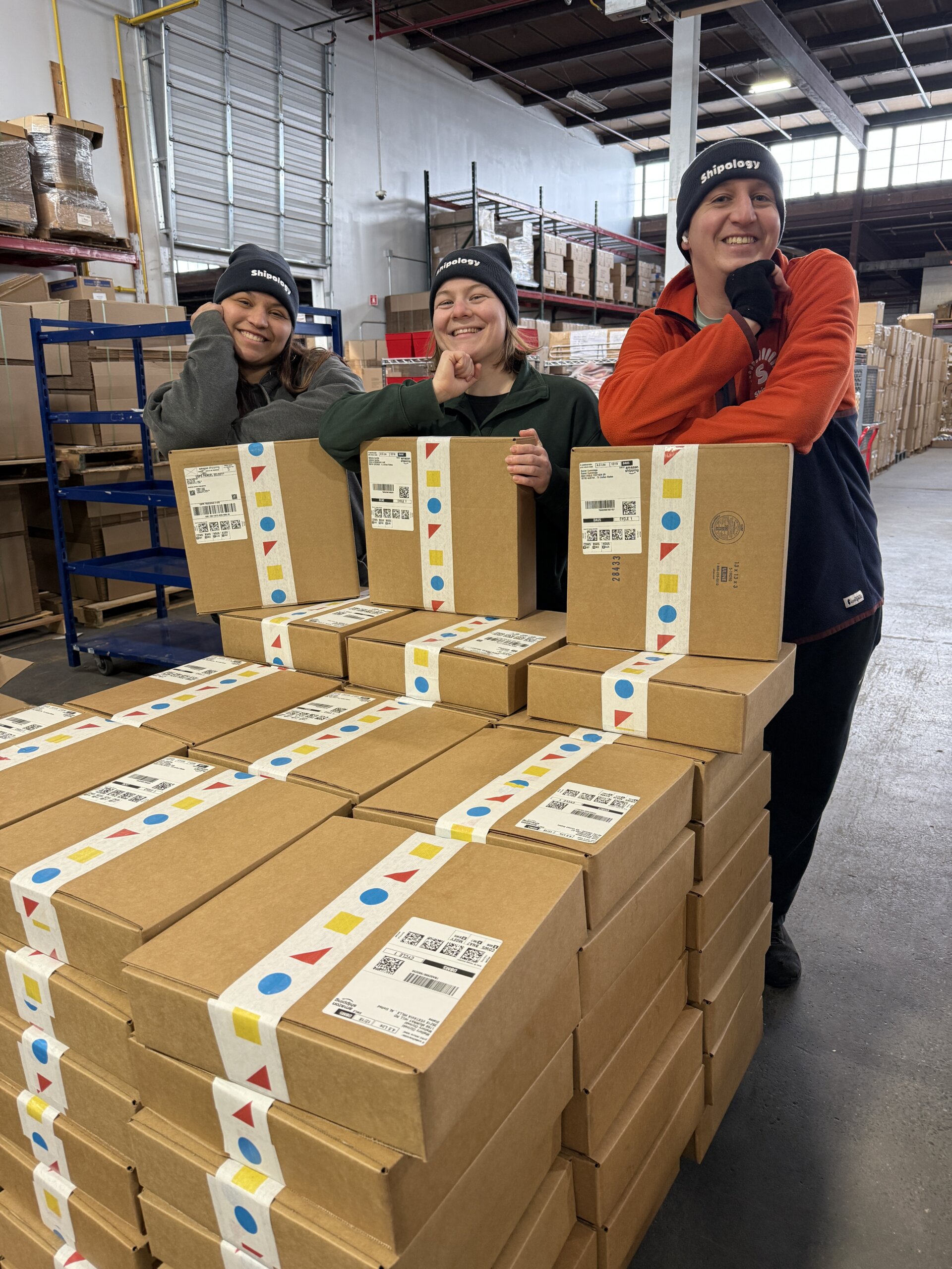 shipology team members preppping boxes